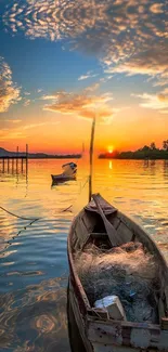 Tranquil sunset over a serene lake with boats and golden reflections.