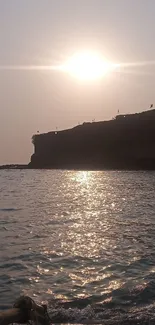 Serene sunset over a clifftop by the sea