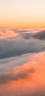 Serene sunset over clouds with power tower.