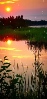 Vibrant sunset over a reflective lake with silhouettes of trees.