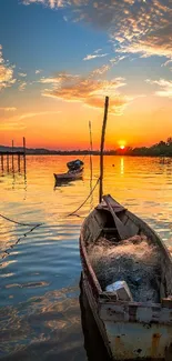 Serene sunset over lake with boats and vibrant sky.