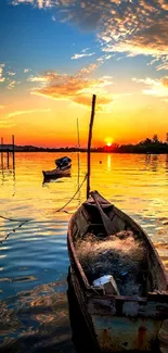 Wooden boat on a lake at sunset with vibrant orange and blue hues.