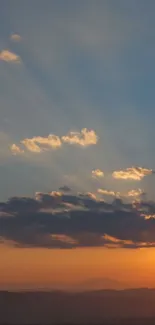 Sunset over mountains with vibrant sky