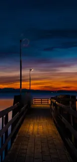 A tranquil sunset over a wooden pier with vibrant orange and blue hues.