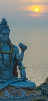 Majestic Shiva statue at ocean sunset.