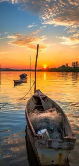 Serene sunset with a boat on a tranquil lake.