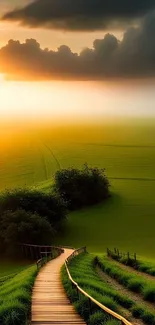 Peaceful wooden path through lush green fields under a glowing sunset sky.