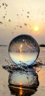 Sunset reflects in a water droplet on a serene surface.