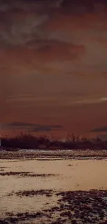 Serene landscape of sunset over water with lighthouse.