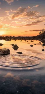 A tranquil sunset over a rocky river with vibrant reflections.