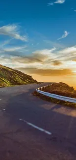 Serene sunset over a winding road and nature landscape.