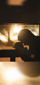 Father and child silhouette at sunset.