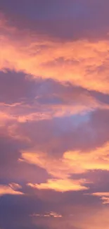 Serene sunset sky with purple and orange clouds.