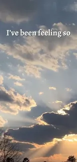 Serene sunset with clouds and sun rays lighting up the sky.