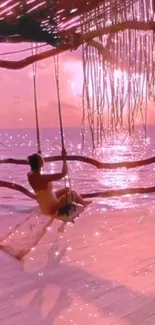 A serene beach swing at sunset with pink skies and ocean.