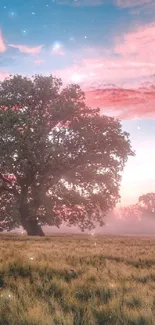 Majestic tree under a vibrant pink and blue sunset sky.