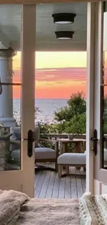 Tranquil sunset view through French doors overlooking the ocean.