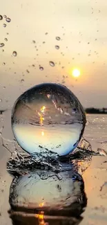 A crystal sphere reflects a serene sunset over water, creating a calming mobile wallpaper.