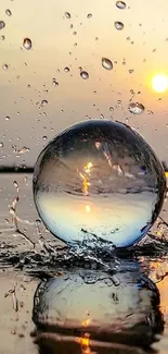 Stunning sunset with water sphere and splash.