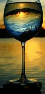 A calming sunset reflection in a wine glass over a serene water landscape.