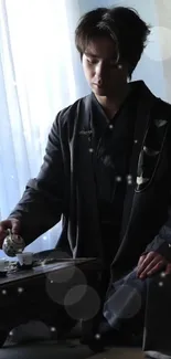 A person serving tea in a traditional ceremony setting.