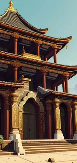 Intricate temple basked in warm sunset light with mountain backdrop.