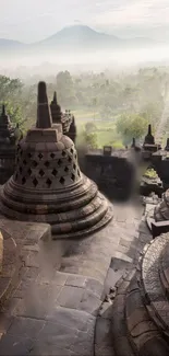 Misty temple landscape at dawn with ancient stone structures.