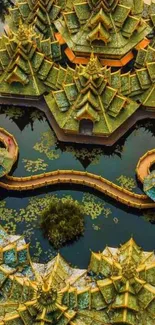 Aerial view of Asian temple with green rooftops reflected in water, creating a serene scene.