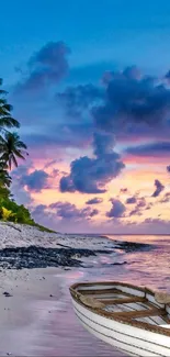 Tropical beach at sunset with calm waters and vibrant sky colors.