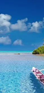 Serene tropical beach with clear blue water and a small boat.