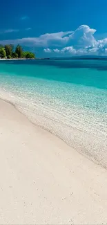 Serene beach with blue water, sand, and sky.