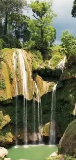 Serene tropical waterfall in lush greenery.