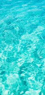 Turquoise ocean water wallpaper for mobile phone, serene and calming.