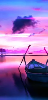 Lonely boat at twilight with pink and purple sky.