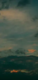 Dark twilight sky with clouds and an evening glow.