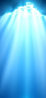 Serene blue light rays underwater creating a calm atmosphere.