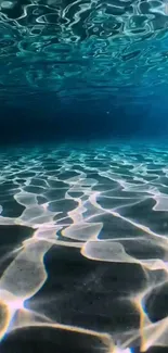 Calm underwater ocean scene with sunlight reflections.