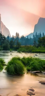 Serene sunset over river in lush valley with mountains.