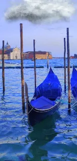 Venice gondolas in calm waters under a cloud