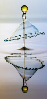 Artistic water drop creating a reflection.