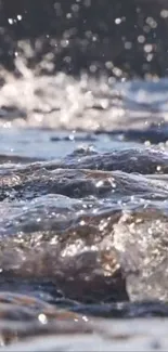 Close-up of water ripples with sunlight reflections.