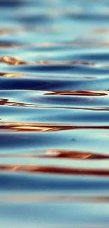 Serene water waves with sunset reflection on mobile wallpaper.