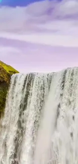 Waterfall with rainbow and pastel sky wallpaper.