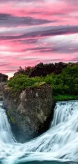 Serene waterfall with pink sunset sky, ideal for mobile wallpaper.