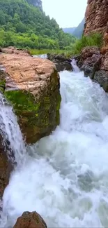 Serene waterfall cascading through rocks with lush greenery.