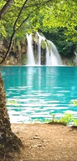 Mobile wallpaper of a serene waterfall with turquoise lake and green trees.