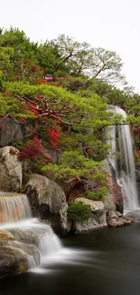 Serene garden scene with waterfalls and vibrant flowers.