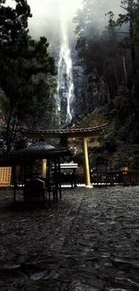 Waterfall in a lush green forest with stone pathway.