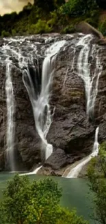 Serene waterfall flowing in lush green forest landscape.