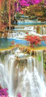 Cascading waterfall with vibrant foliage in a serene setting.